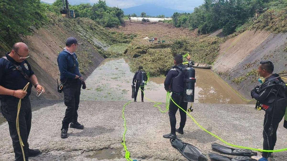 buscan a joven arrastrado en la presa